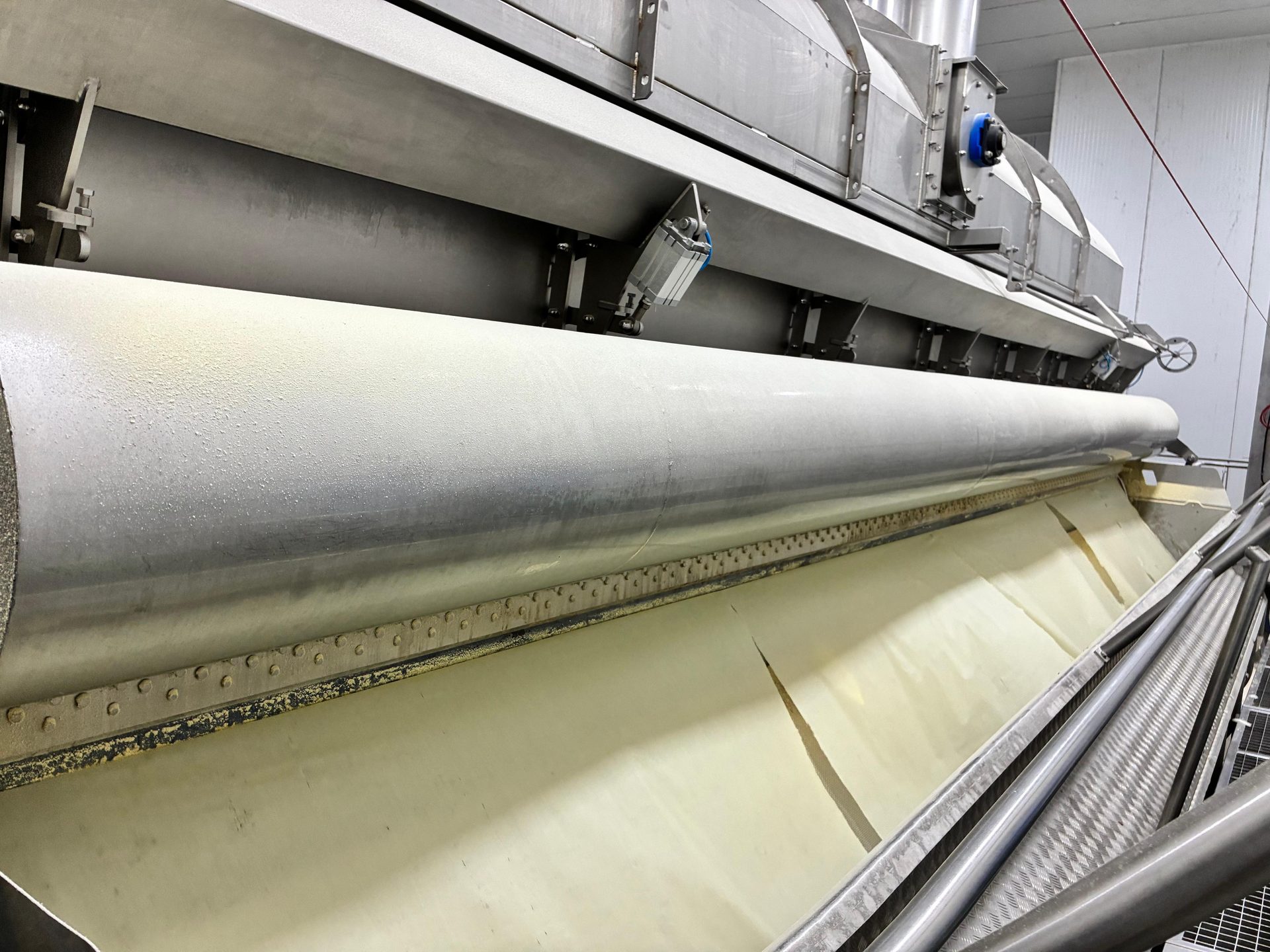 Palletised food-grade ingredient sacks stacked in a clean commercial warehouse